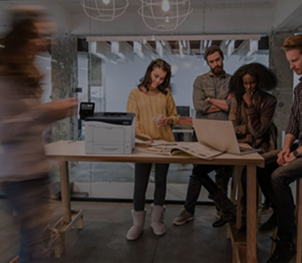 Busy office with Xerox desktop printer