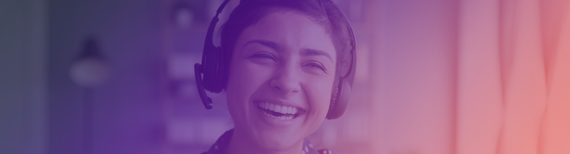 Lady laughing with headset on