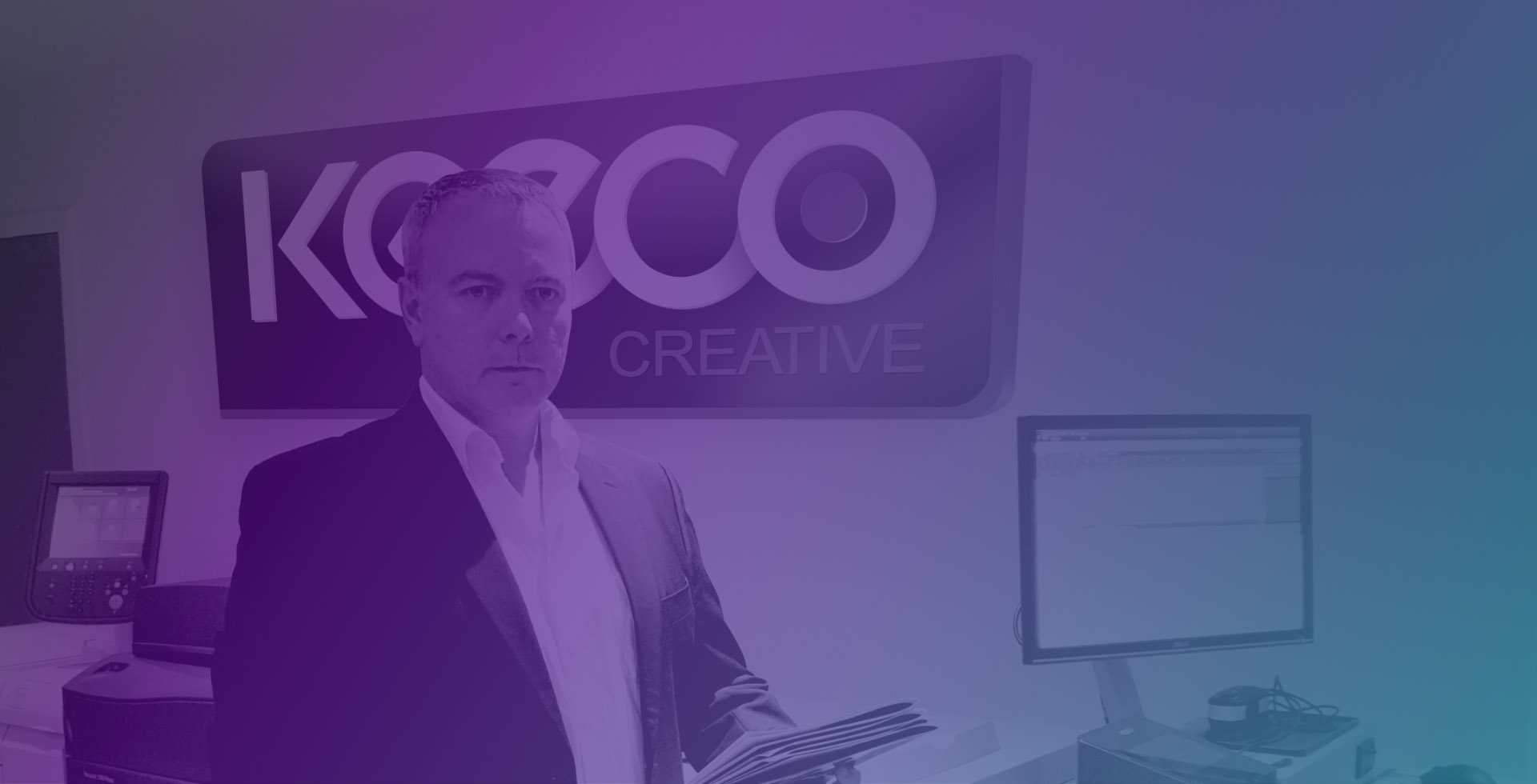 Man stood in front of Keeco sign