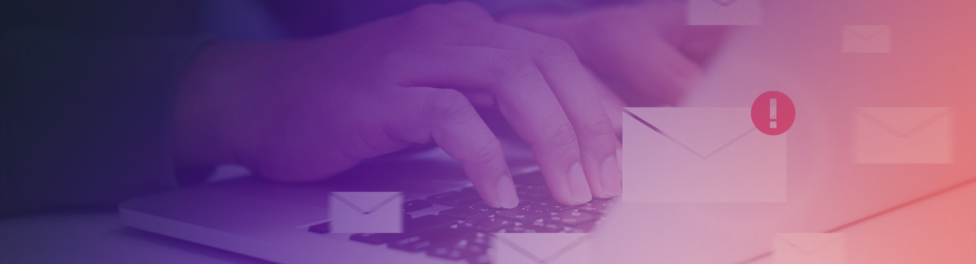 User typing on laptop experiencing an email security incident with a warning message
