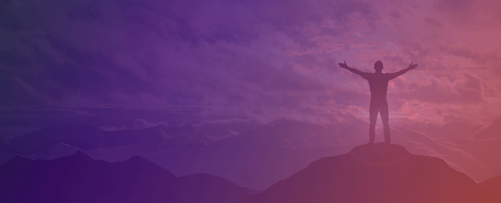 Man standing on the top of a mountain