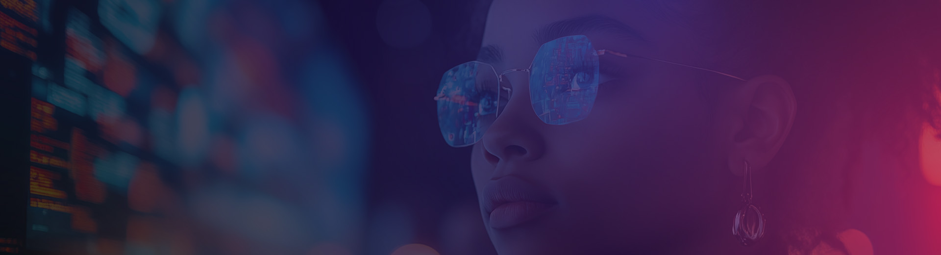 Lady with glasses looking at screen